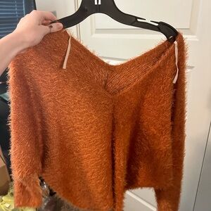 Cute off the shoulder orange sweater!
